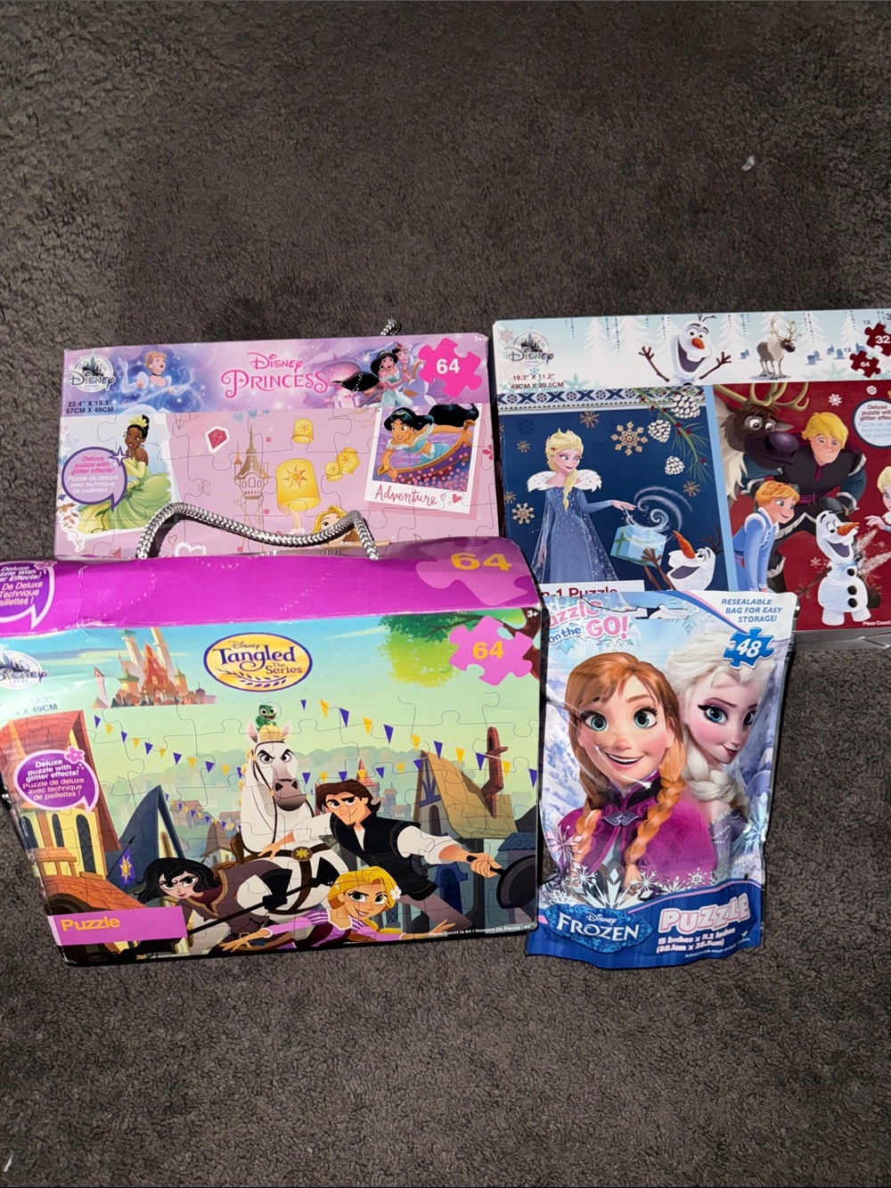 Three Brand New Disney Puzzles & One Used puzzle